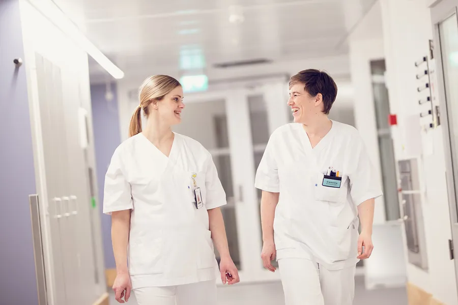 A couple of women in white shirts